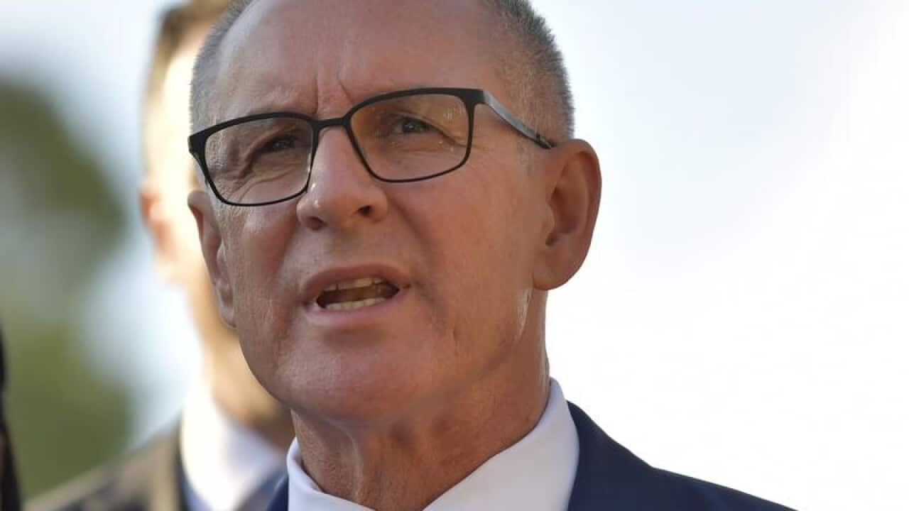 SA Premier Jay Weatherill speaks to press at a train crossing.