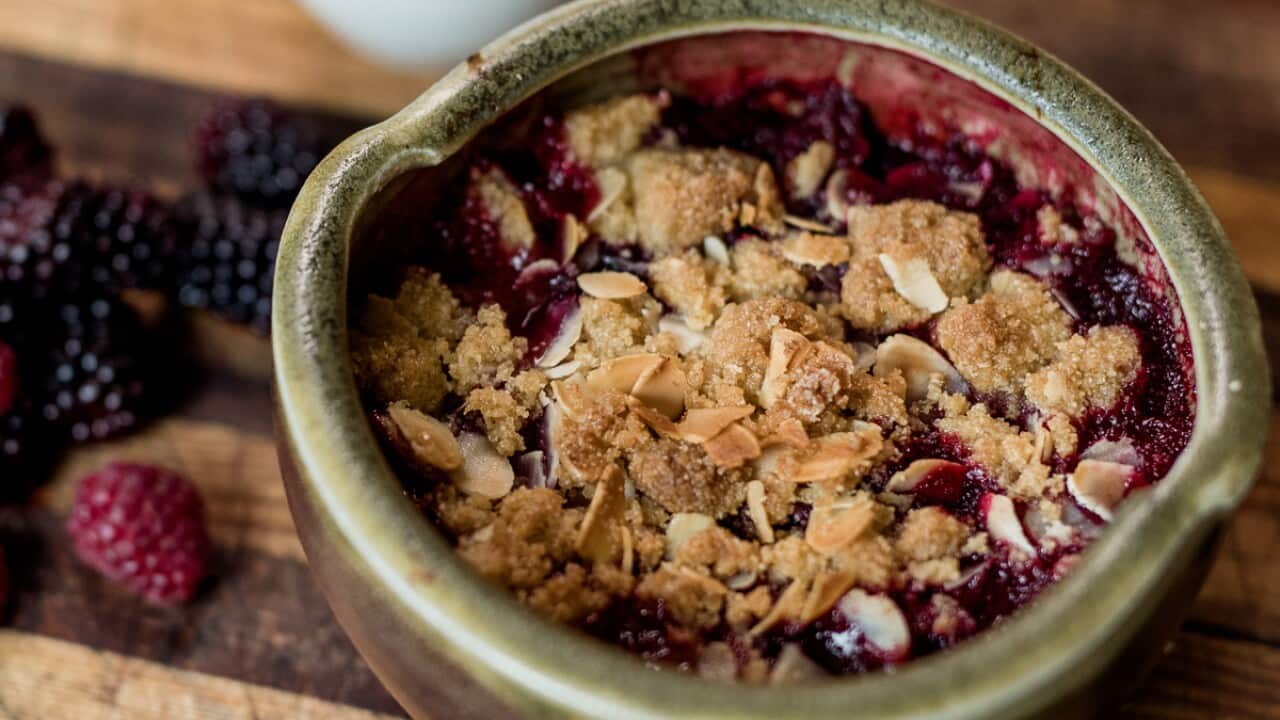Rhubarb and berry crumble with goat's milk and vanilla custard