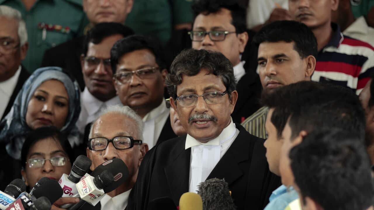 Prosecutor Sultan Mahmud Simon talks to the media outside court after four men were sentenced to death in Dhaka, Bangladesh.