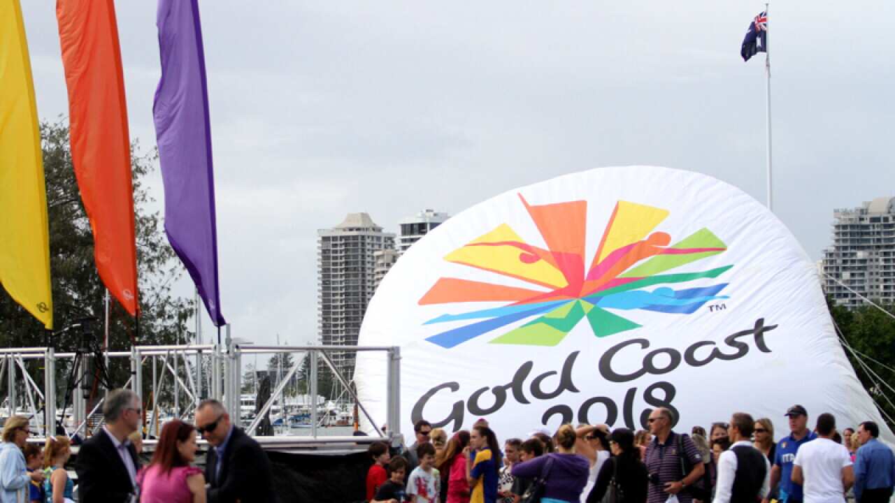Locals gather around The Gold Coast 2018 Commonwealth Games emblem