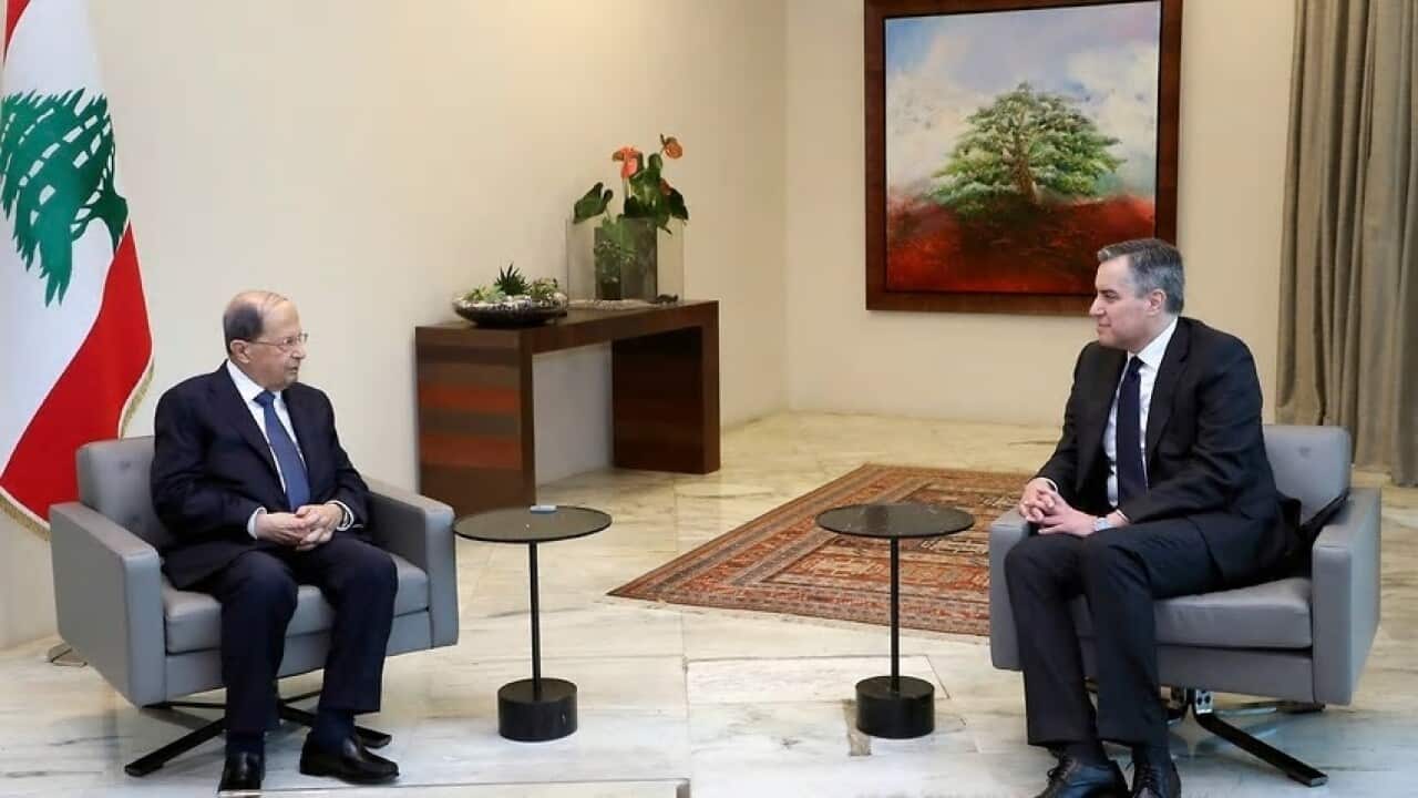 Lebanese President Michel Aoun, left, meets with Lebanese Prime Minister-designate Mustapha Adib, at the Presidential Palace in Baabda. Source: Lebanese government/AAP