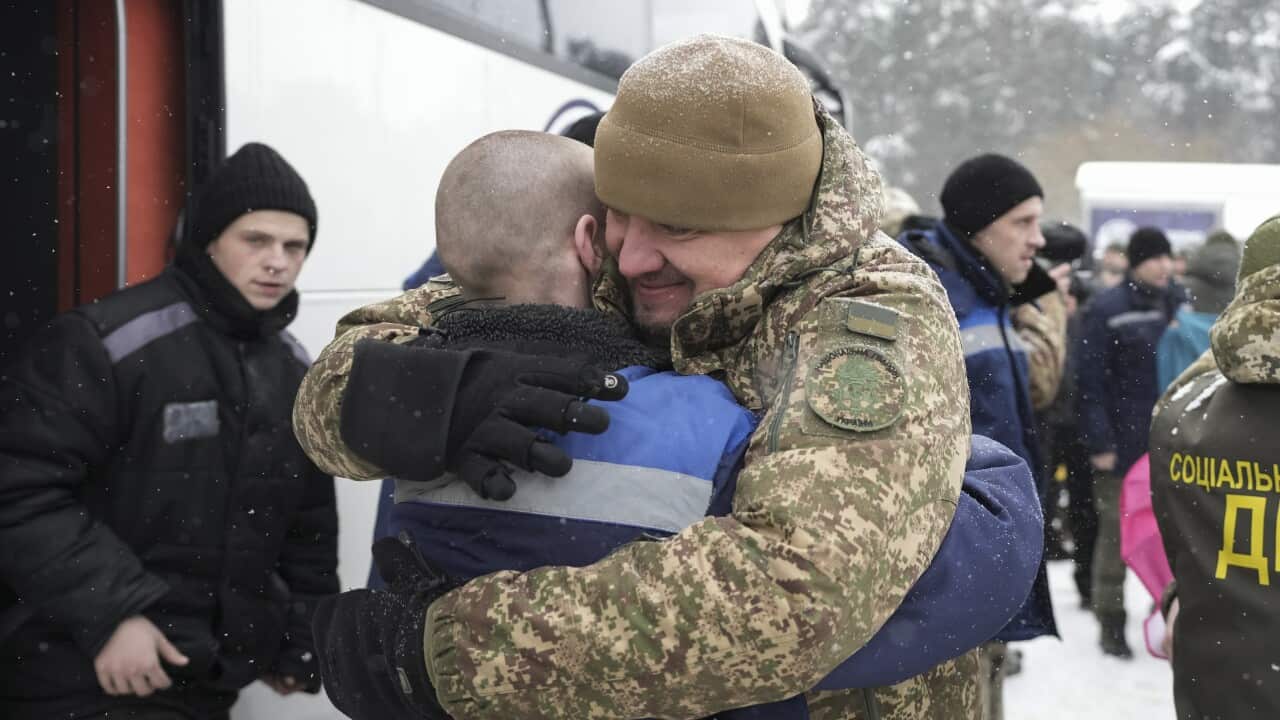 Ukrainian prisoners of war (POWs) react following a prisoner swap