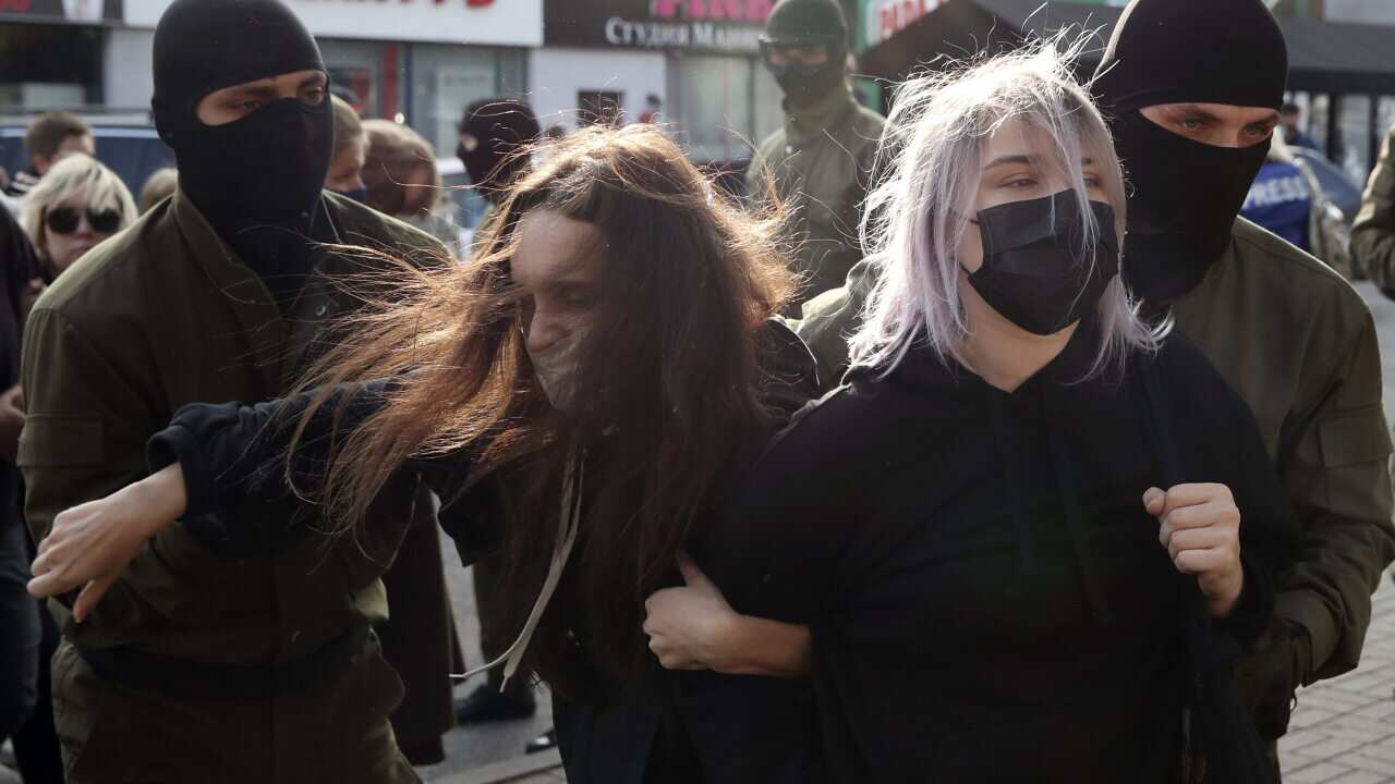 Riot police in Belarus on Saturday bundled hundreds of women into vans.