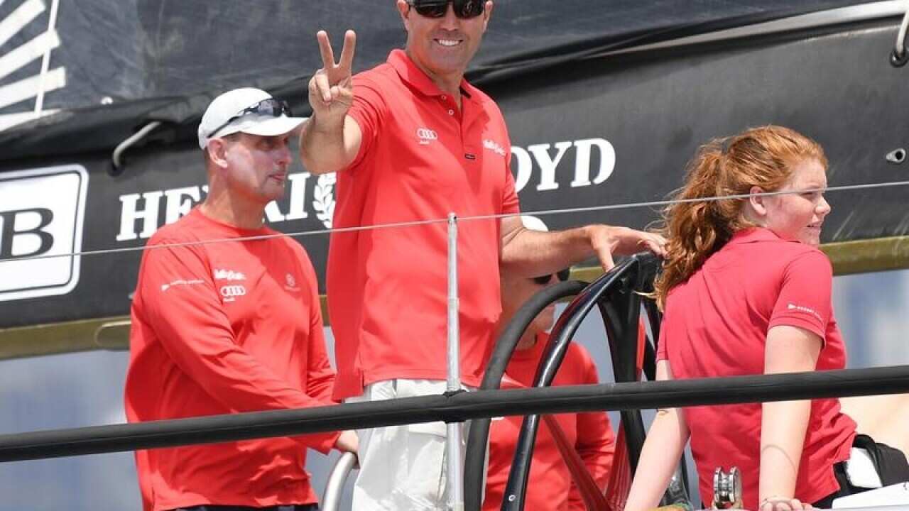Mark Richards, the skipper of Wild Oats XI, gestures