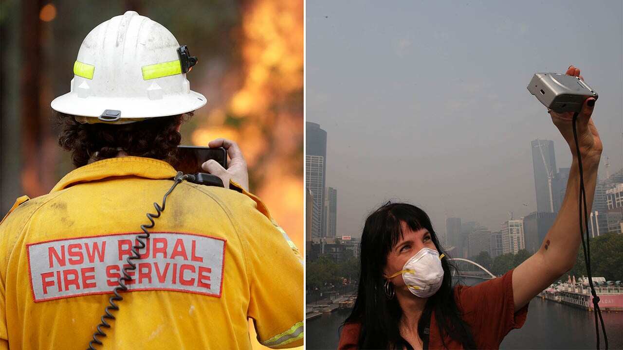 A tourist (right) snaps a selfie in Melbourne amid a haze of bushfire smoke. The federal government will roll out a massive package in a bid to ramp up tourism.