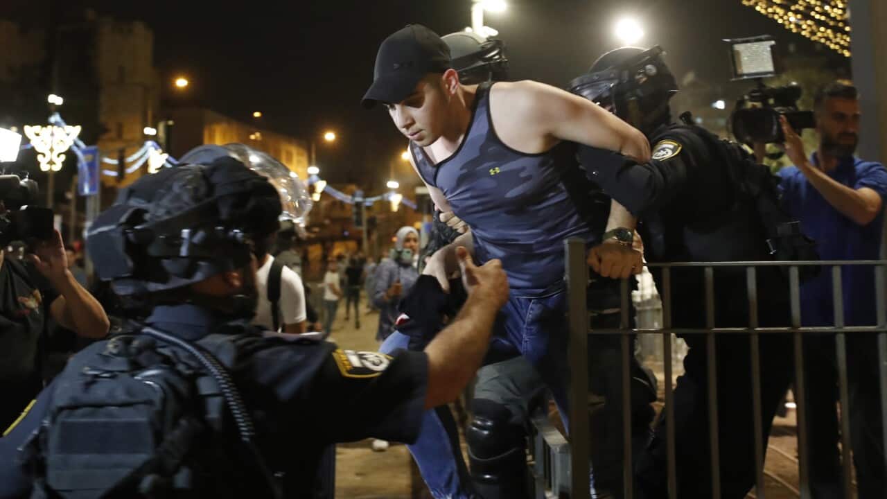 Israeli police arrest Palestinian protesters during the nightly protests near Damascus Gate of Jerusalem's old city, 9 May 2021.