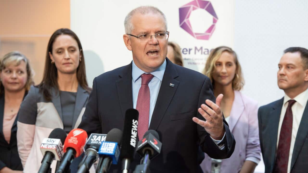 : Prime Minister Scott Morrison speaks to the media during a tour of Peter MacCallum Cancer Centre in Melbourne