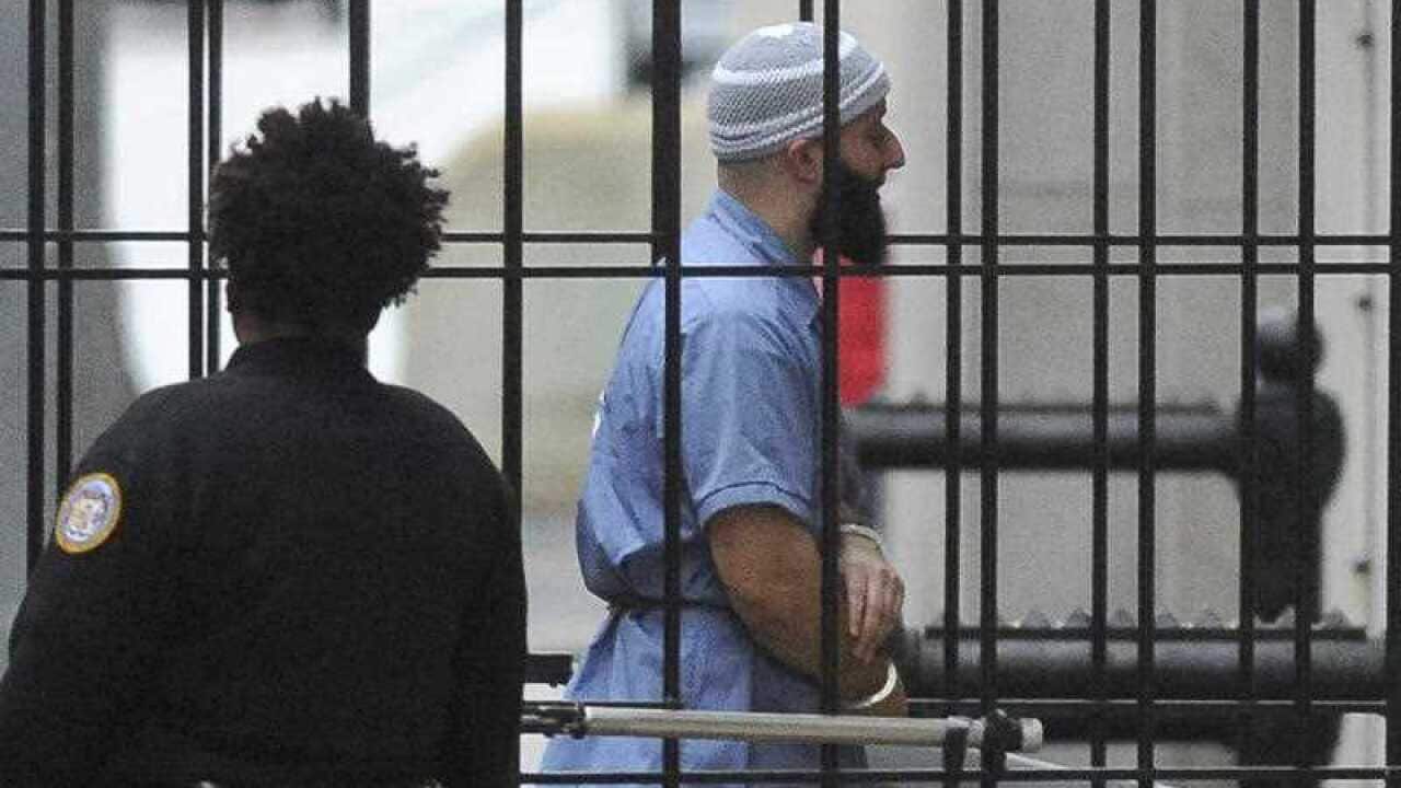 In this Feb. 3, 2016 file photo, Adnan Syed enters Courthouse East in Baltimore prior to a hearing.