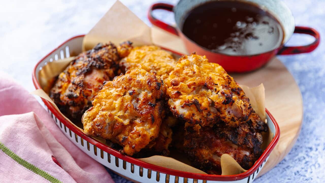 Gluten-free crispy airfryer chicken pieces with sweet and sour dipping sauce.