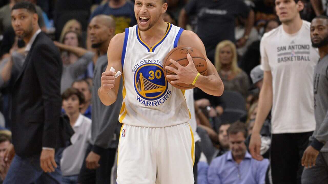 Golden State Warriors guard Stephen Curry celebrates