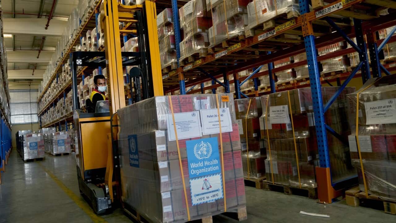 A forklift driver loads healthcare materials to be sent to Afghanistan at a UNHCR warehouse, part of the International Humanitarian City in Dubai, United Arab Emirates, Monday, June 27, 2022. (AP Photo/Kamran Jebreili)