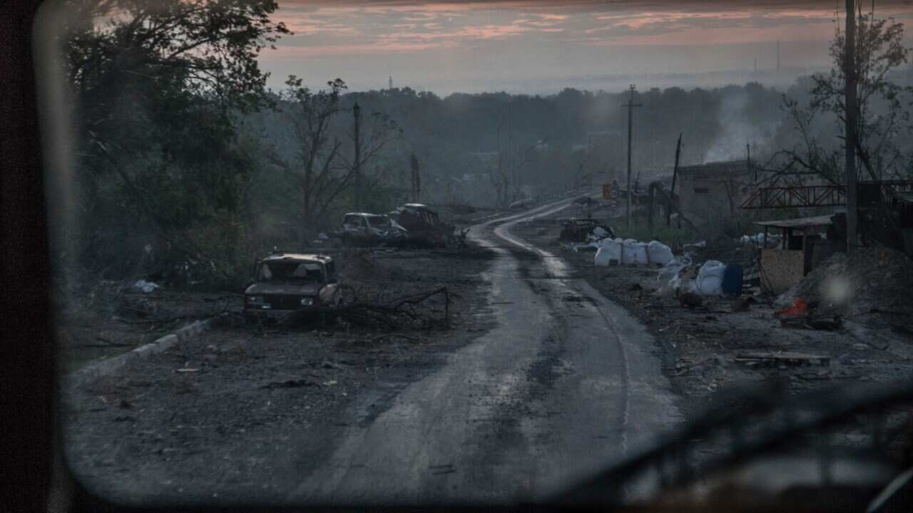 The gutted remains of cars lie along a road during heavy fighting at the front line in Severodonetsk, Luhansk region, Ukraine, Wednesday, June 8, 2022.