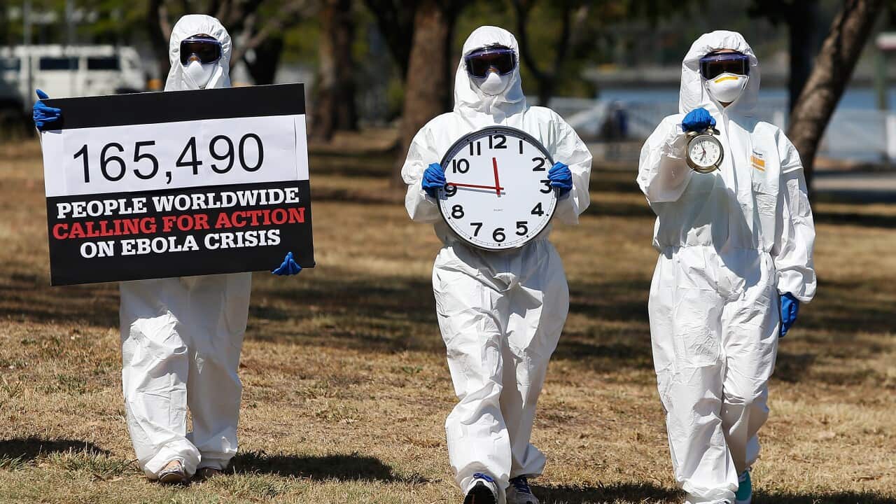 Activists in Brisbane dressed as front line Ebola health workers protest to demand G20 action to fight the disease. (Getty)