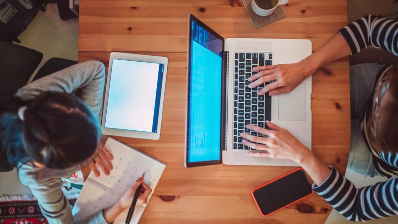 Mum daughter on devices