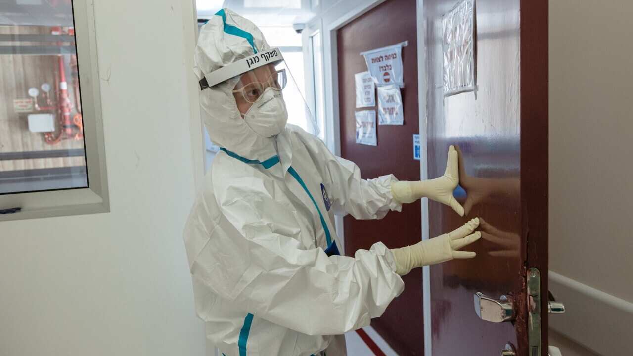 A doctor is seen at the entrance to an isolated ward to treat Covid-19 patients at Hadassah hospita
