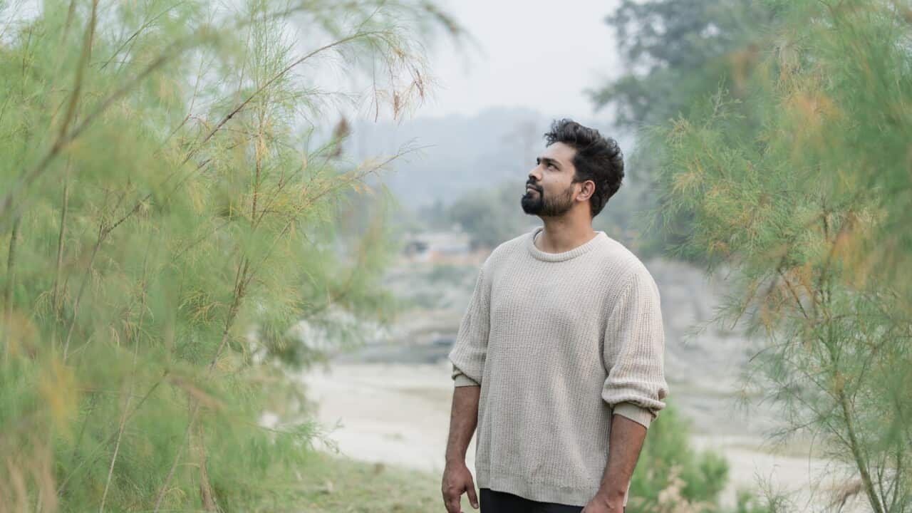 Portrait of a young man in the forest.