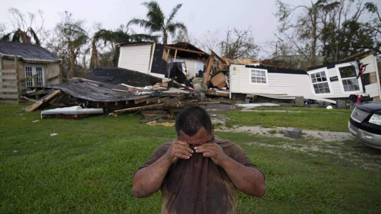Jay Breaux wipes sweat from his eyes after going through his hurricane destroyed home in the aftermath of Hurricane Ida, Saturday, Sept. 4, 2021, in Dulac, La. (AP Photo/John Locher)