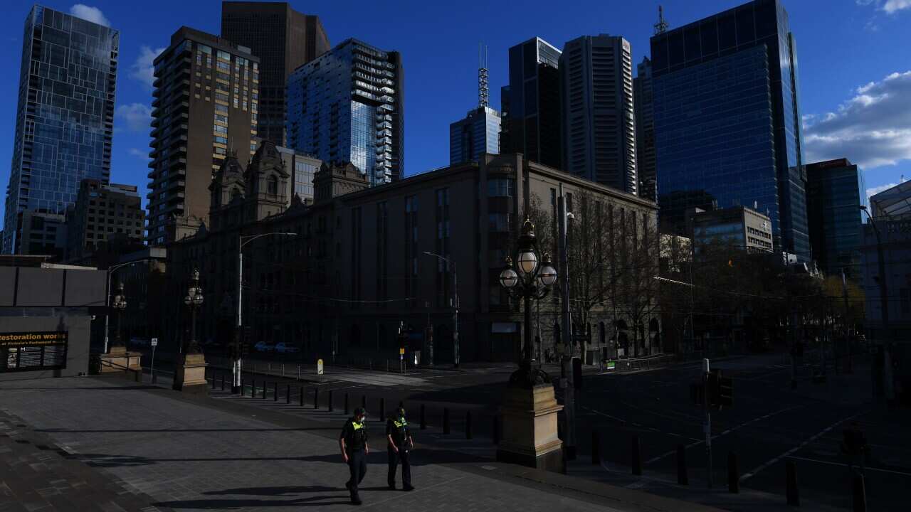 Victoria Police are seen outside the Victorian parliament building in Melbourne on 10 September.