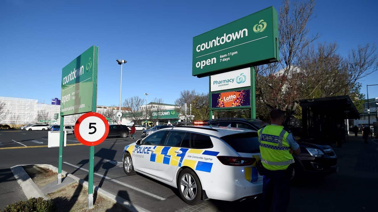 A police officer is observed cordoning off the Dunedin Central Countdown carpark on 10 May, 2021 in Dunedin, New Zealand.