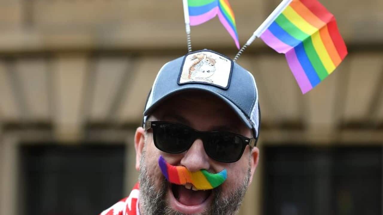 A protester arrives for a rally in support for marriage.