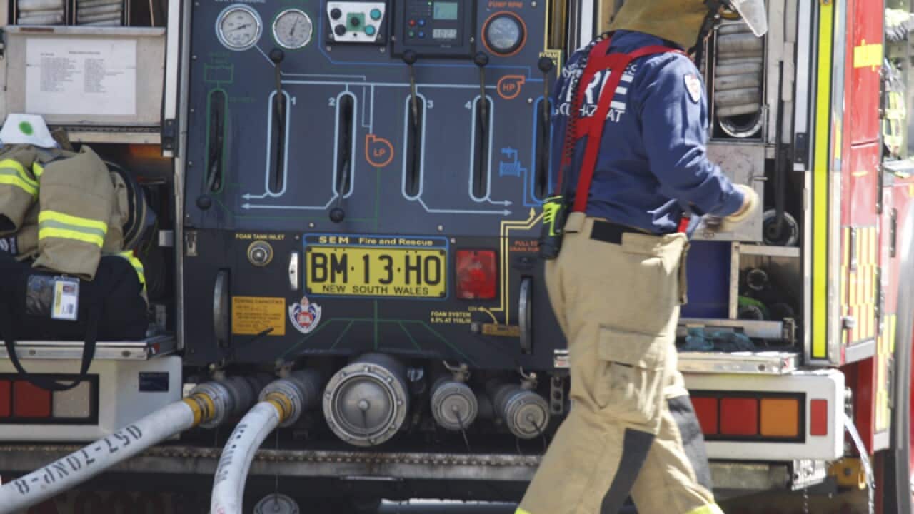 Fire and police emergency services at a scene of a fire