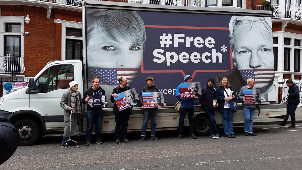 Supporters of Julian Assange hold placards outside of the Ecuadorian Embassy in London earlier this month.