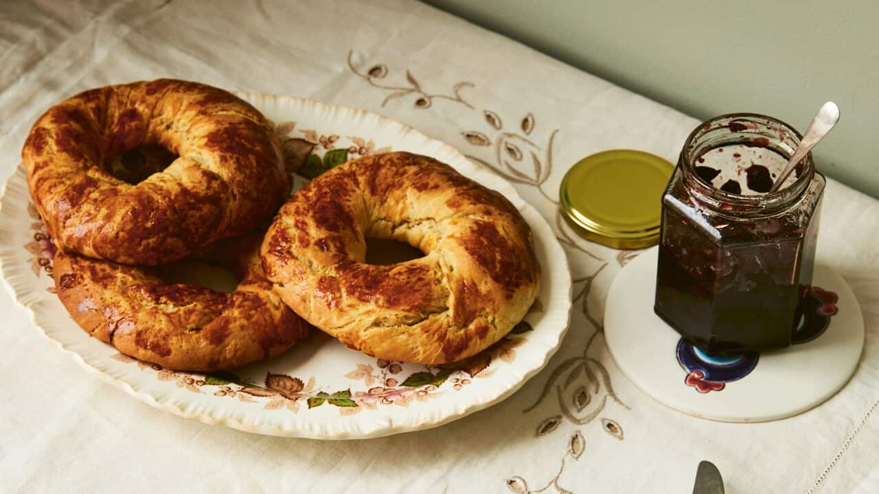Sour cherry jam with soft bread rolls.