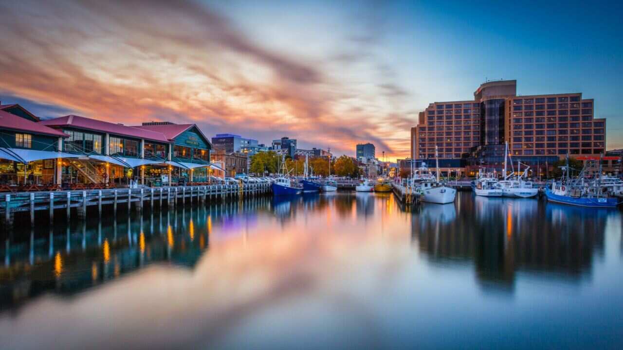 An international student who worked at Tasmania's Grand Chancellor hotel, Hobart, was diagnosed with covid-19