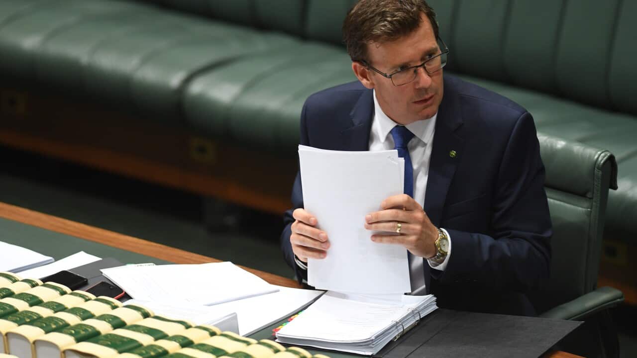 Australia's Human Services Minister Alan Tudge reacts during House of Representatives Question Time at Parliament House in Canberra, Wednesday, Feb. 8, 2017. (AAP Image/Lukas Coch) NO ARCHIVING
