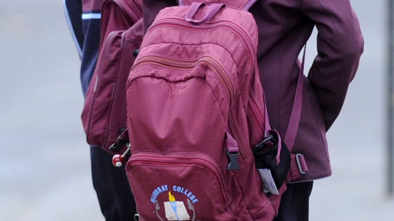 Students walk into Mowbray College in Melton in Melbourne