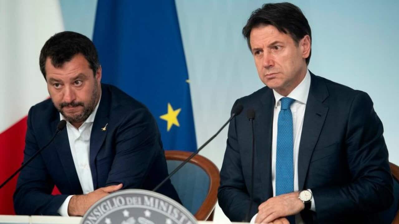 Italian Deputy Premier and Interior Minister, Matteo Salvini, left, and Premier Giuseppe Conte attend a press conference following a Cabinet meeting at Chigi Palace premier's office in Rome, Tuesday, June 11, 2019. (Maurizio Brambatti/ANSA via AP)