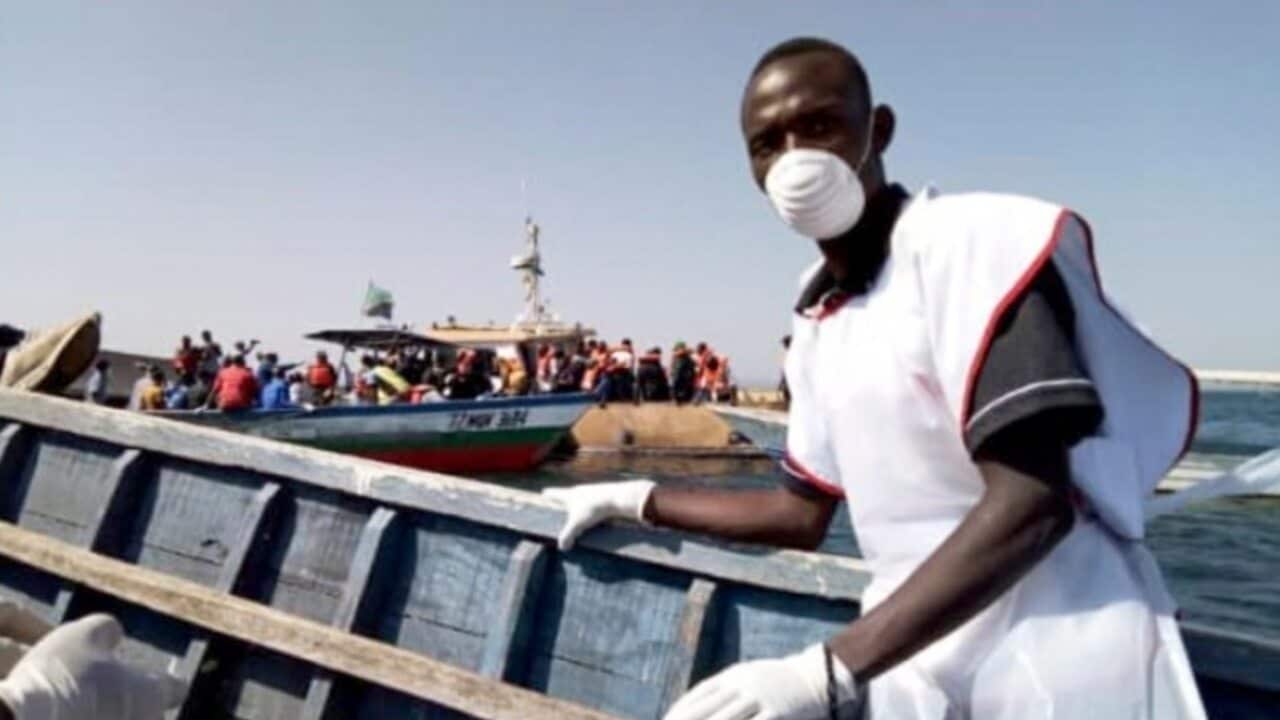 handout photo made available by the Tanzania Red Cross shows Red Cross volunteers during rescue operation near Ukerewe island in Lake Victoria, Tanzania