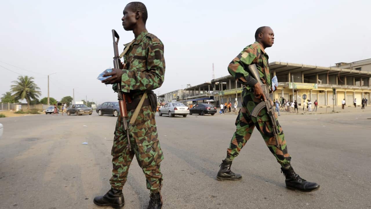Soldiers involved in a mutiny control a street in Abidjan, Ivory Coast, 07 January 2017.