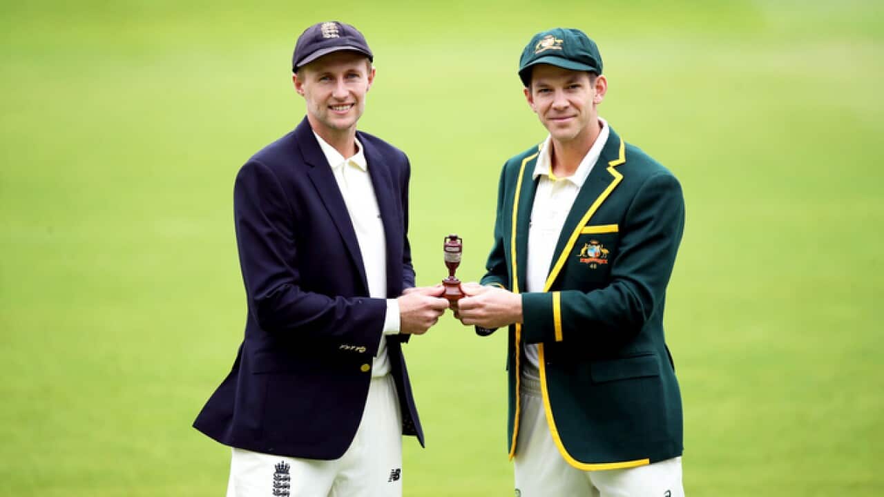 Joe Root of England (L) and Tim Paine of Australia (R) pose with the Ashes Urn trophy at Edgbaston Cricket Ground, Birmingham.