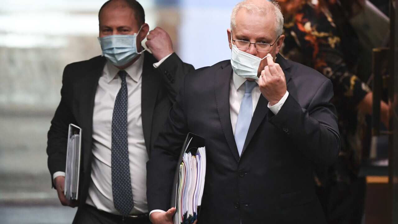 Australian Prime Minister Scott Morrison (right) and Australian Treasurer Josh Frydenberg arrive during House of Representatives Question Time at Parliament House in Canberra, Monday, August 24, 2020. (AAP Image/Lukas Coch) NO ARCHIVING