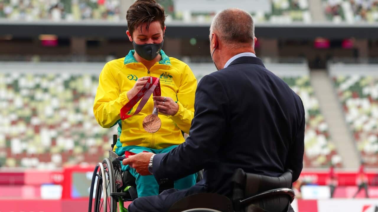 Robyn Lambird gets her bronze medal for the Women's 100m T34 at the Tokyo Paralympic Games
