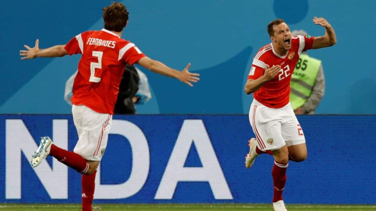 Artem Dzyuba (R) of Russia celebrates after scoring a goal during the 2018 FIFA World Cup match between Russia and Egypt at the Saint Petersburg Stadium.