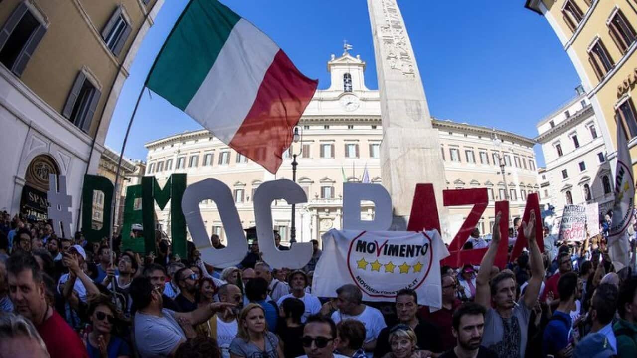 Supporters of the anti-establishment 5-Star Movement (M5S) stage a protest outside the Lower House