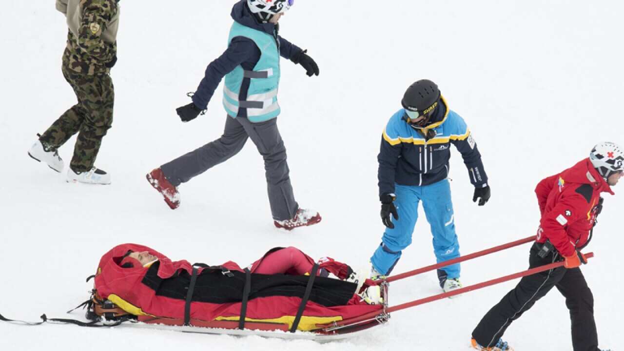 Olivier Jenot of Monaco is evacuated from the slope after a crash