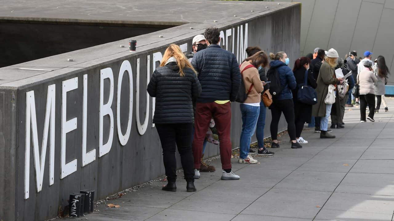 People lining up outside a mass vaccination centre in Melbourne on 5 June, 2021.
