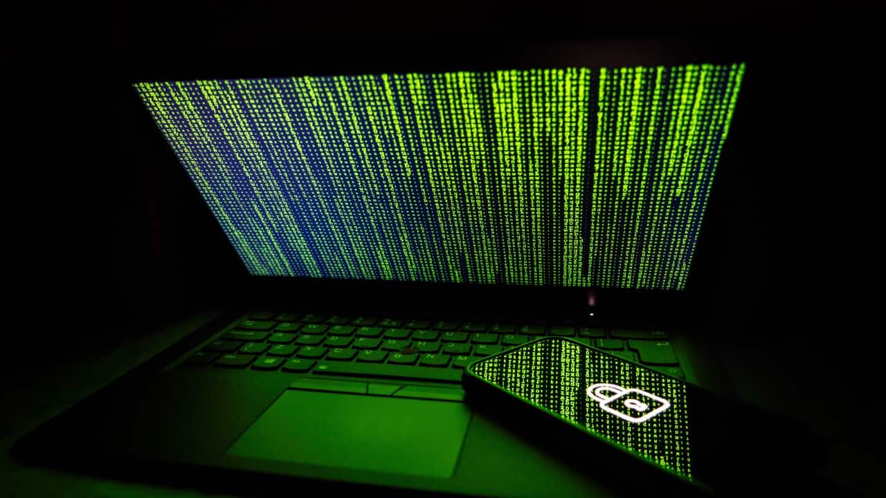 Cybercrime illustrative image on a laptop and smartphone