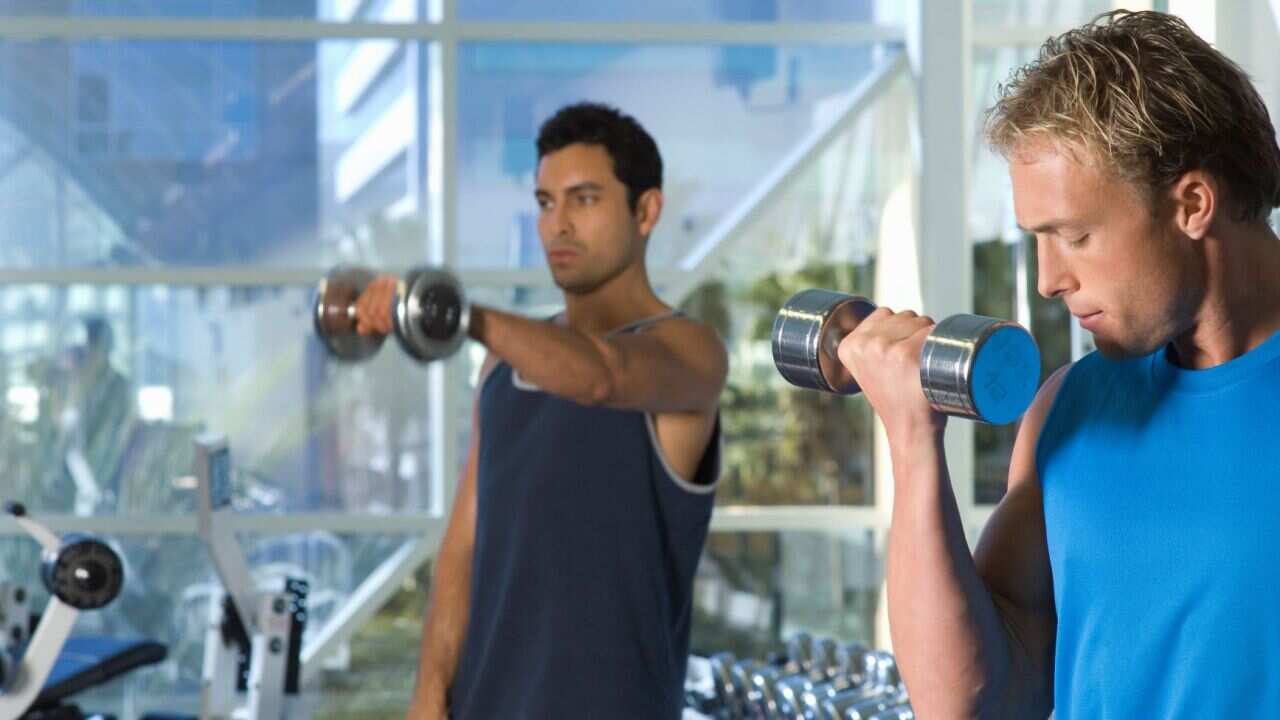 Men Weightlifting With Dumbbells