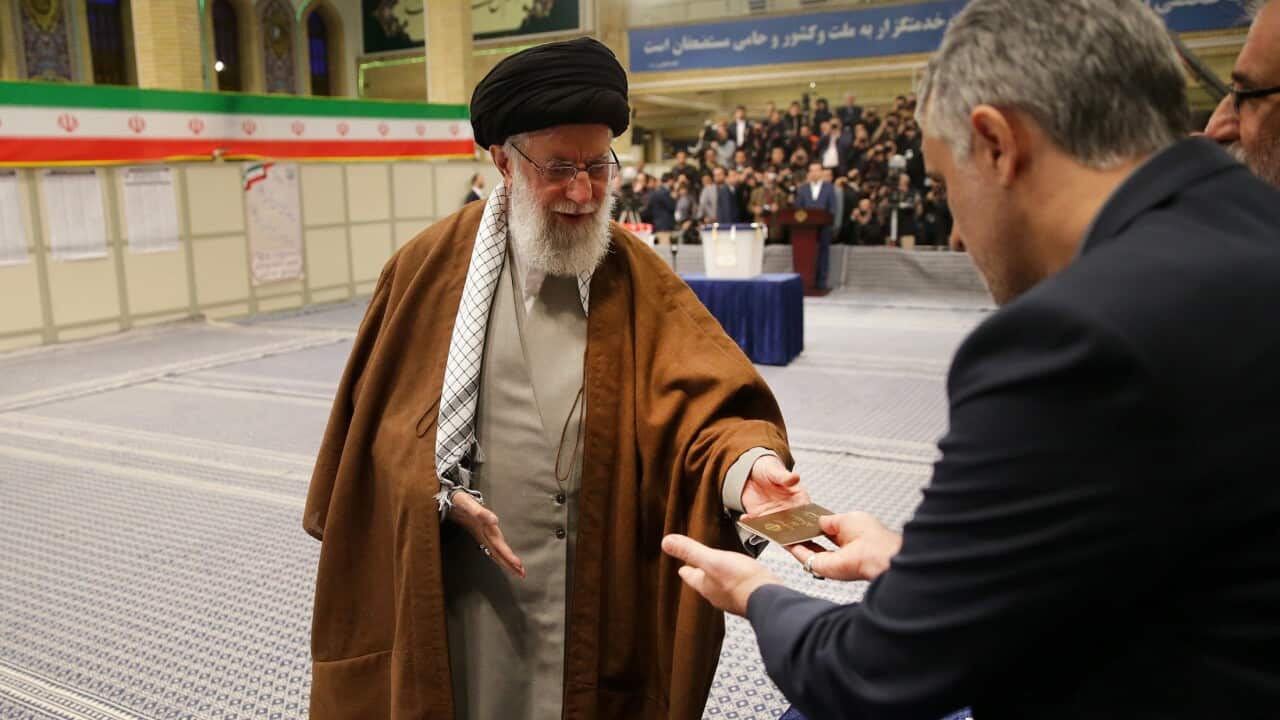 Iranian Supreme Leader Ayatollah Ali Khamenei (L) arriving at a polling station to vote in the parliamentary elections, in Tehran, Iran, 21 February 2020.