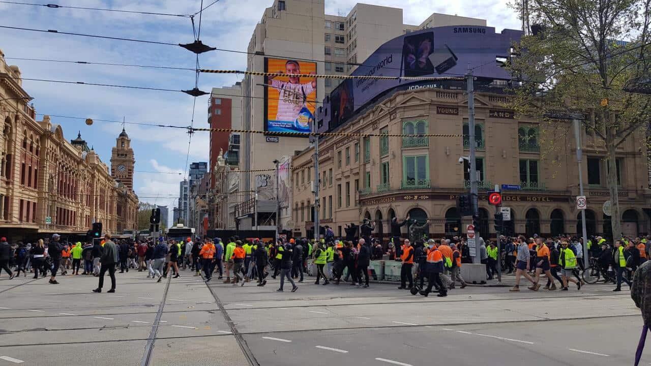 vaccinations for the construction industry and other health restrictions have marched in Melbourne.
