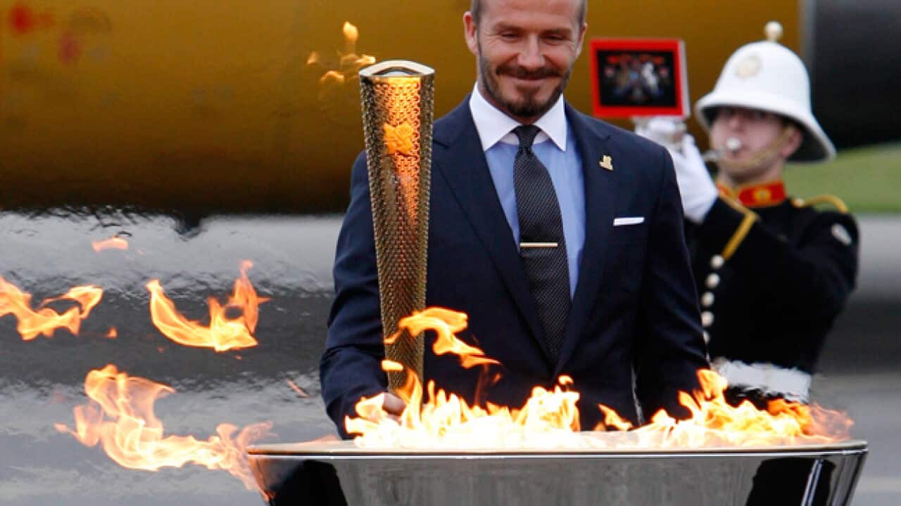 oly_torch_beckham_120519_aap_b_624017269