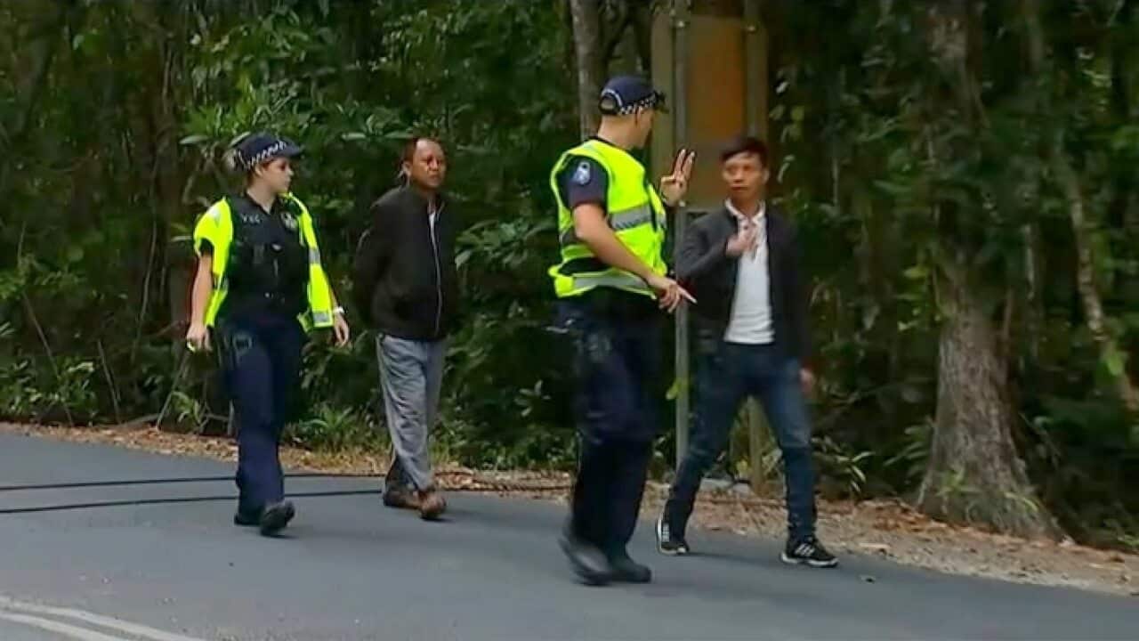 Queensland police detain two of the people from the boat that ran aground