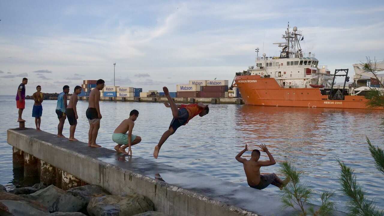 thumbnail_Teenagers jump into the ocean at Avatiu Harbour, Rarotonga (SBS Lucy Murray).jpg