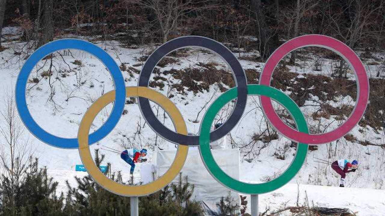 Competitors pass the Olympic rings during the Men's 50km Mass Start Classic at the Alpensia Cross Country Centre during day fifteen of the PyeongChang 2018 Winter Olympic Games in South Korea.