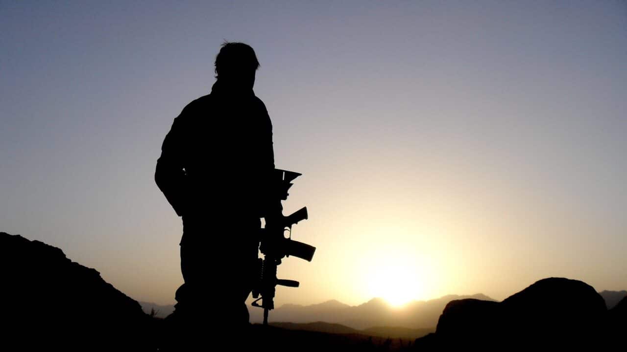 An Australian Special Operations Task Group soldier observing the valley during the Shah Wali Kot Offensive.