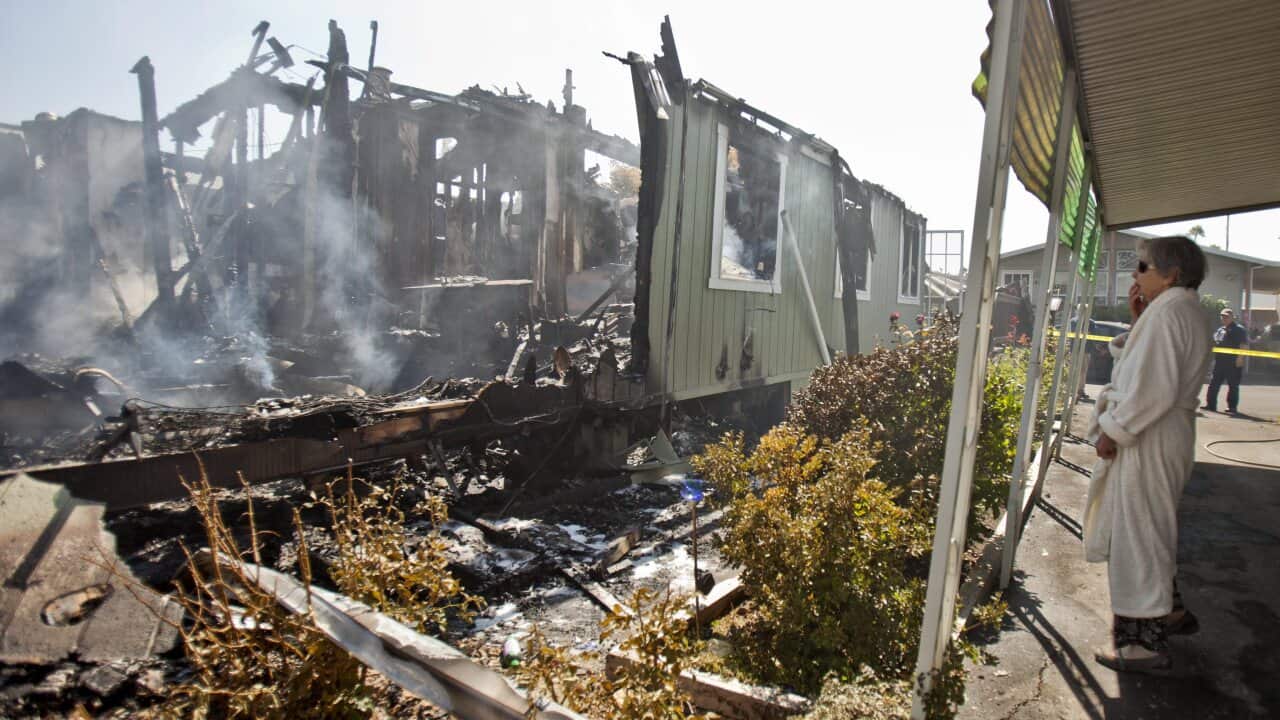 Nola Rawlins 83, surveys her home, that was destroyed by a fire at the Napa Valley mobile home park after a 6.1 magnitude earthquake hit the San Francisco Bay Area (AAP)
